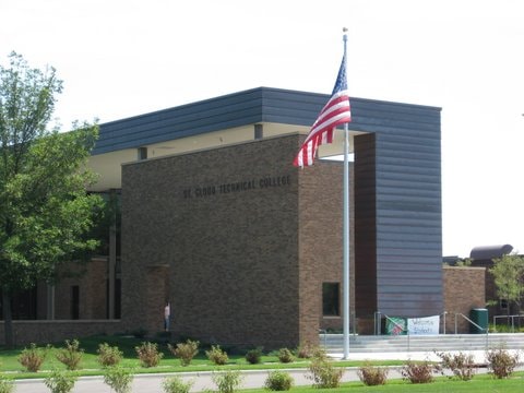 Brick building with American flag at entrance