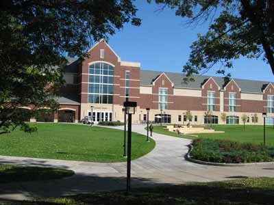Brick building with manicured lawn and grounds